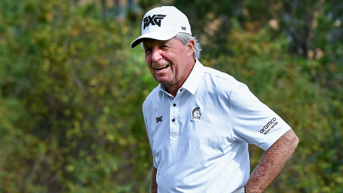 Gary Player laughs during a golf round