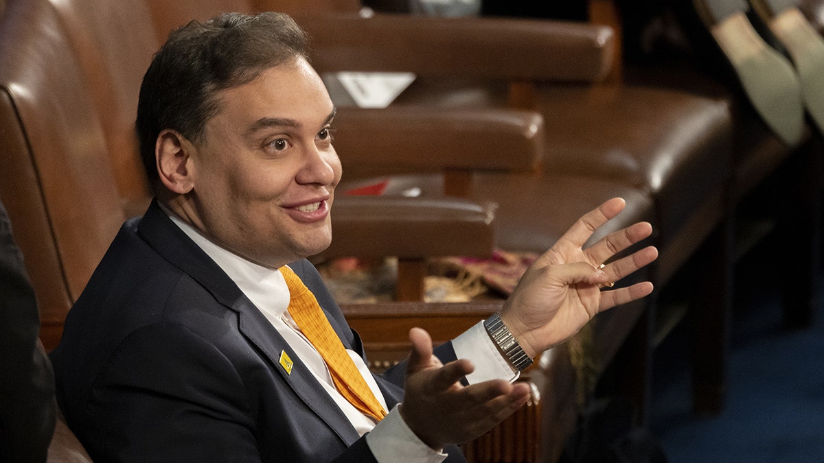 George Santos smiles on Capitol Hill