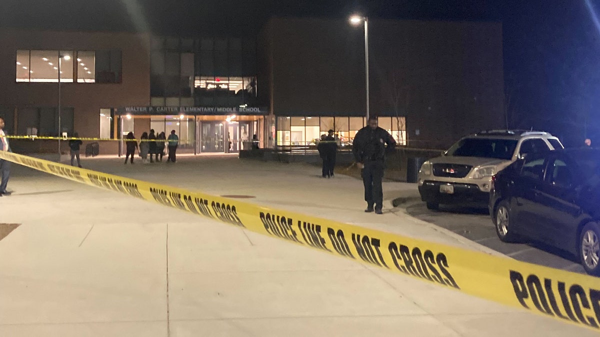Police tape surrounds a middle school