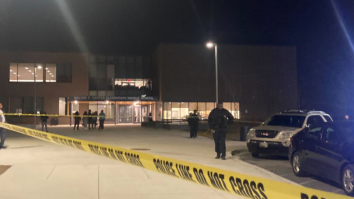 Police tape surrounds a middle school