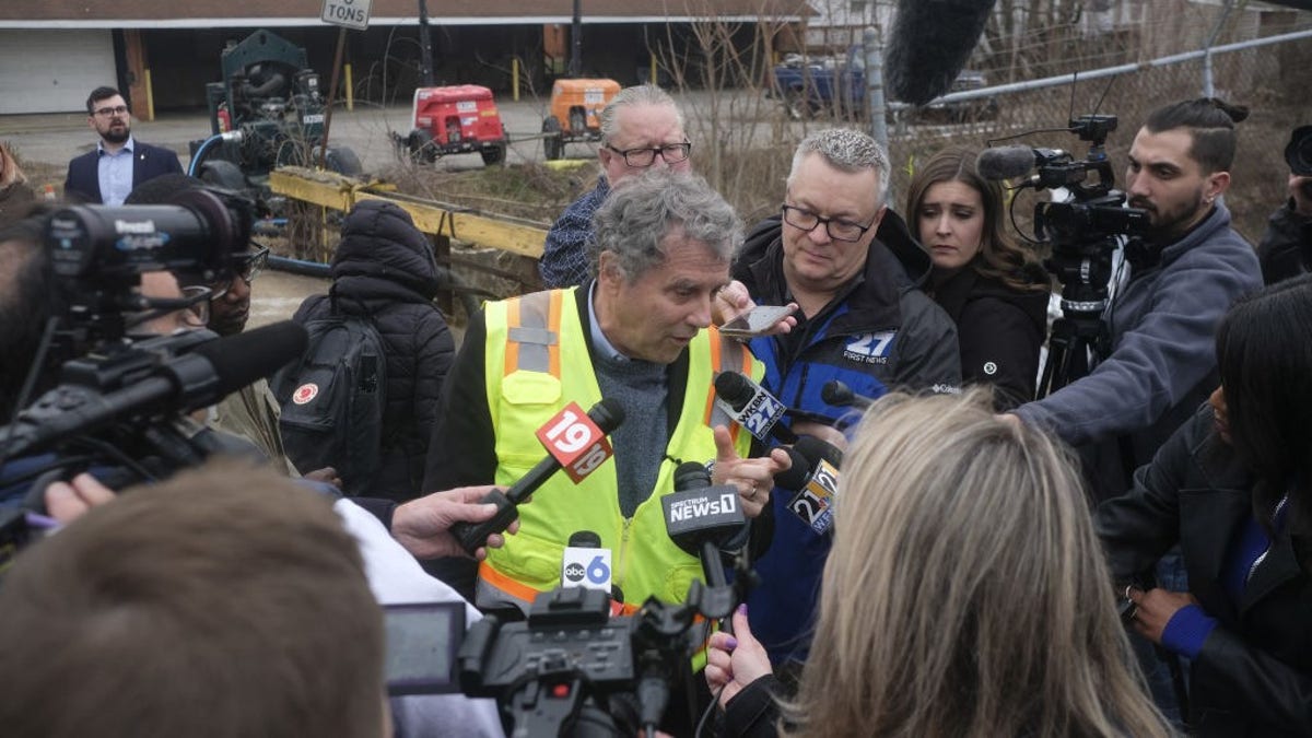 Sen. Brown talking to people at train derailment site in Ohio