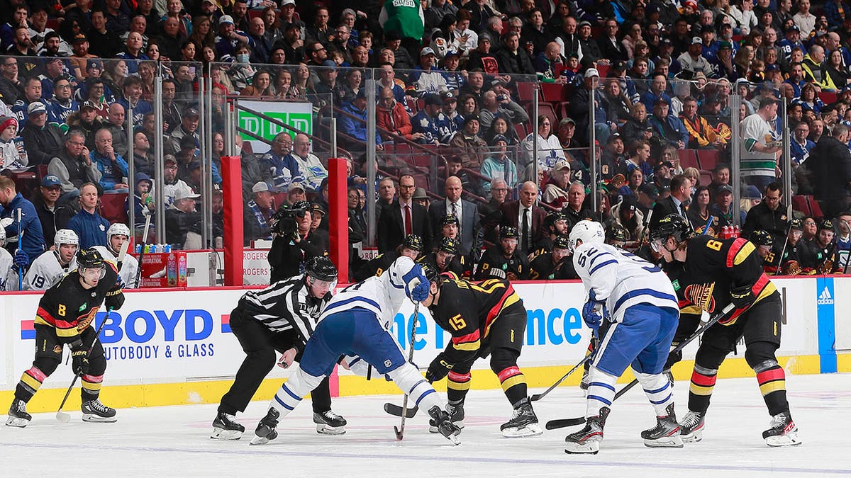 Maple Leafs and Canucks faceoff