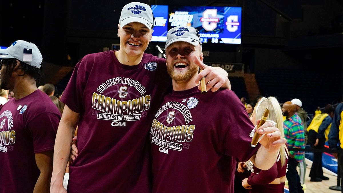 The Charleston Cougars celebrate the CAA championship