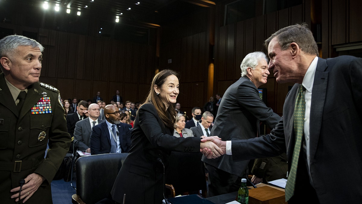 Avril Haines shakes hands with Senate intelligence committee chairman