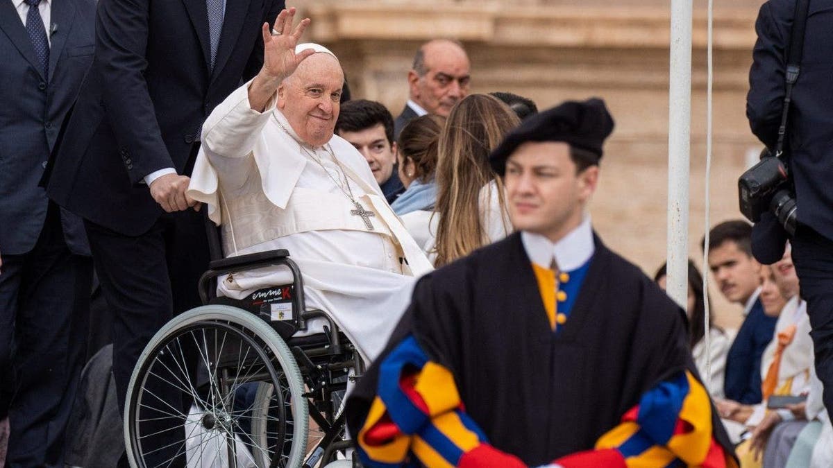 Pope Francis is pushed in wheelchair in St. Peter's Square at the Vatican