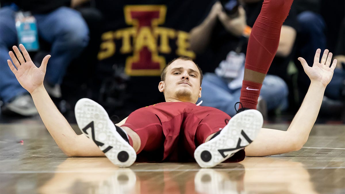 Eli King of Iowa State reacts after being knocked to the floor