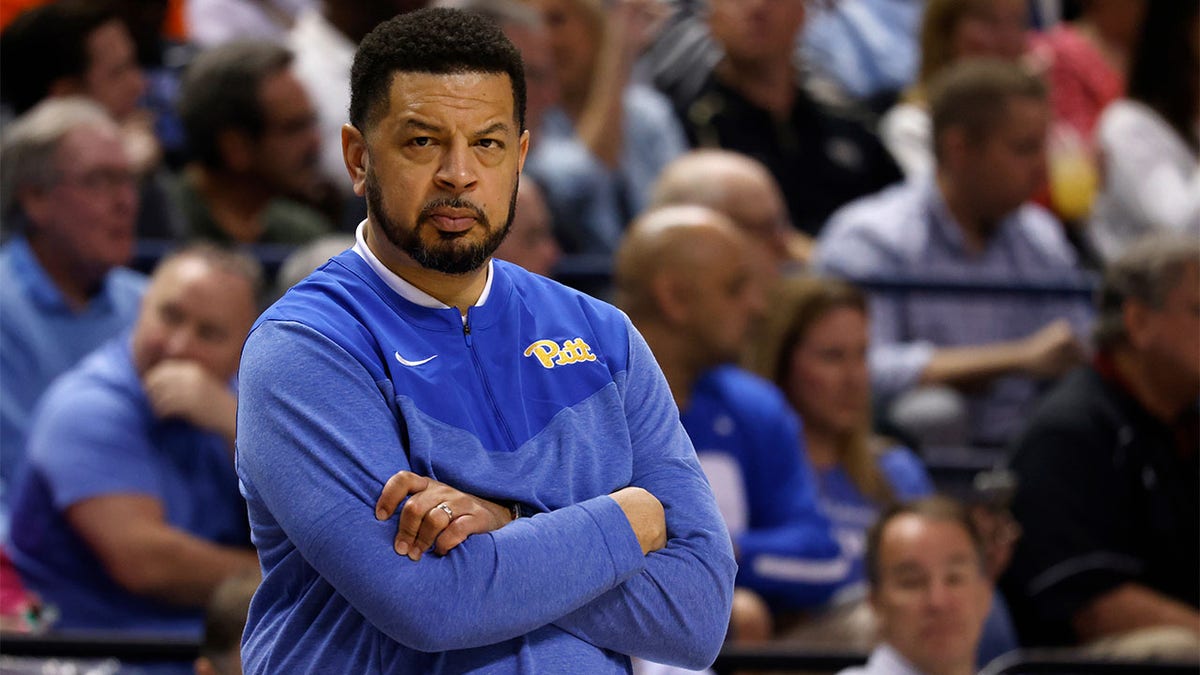 Jeff Capel of Pitt looks on