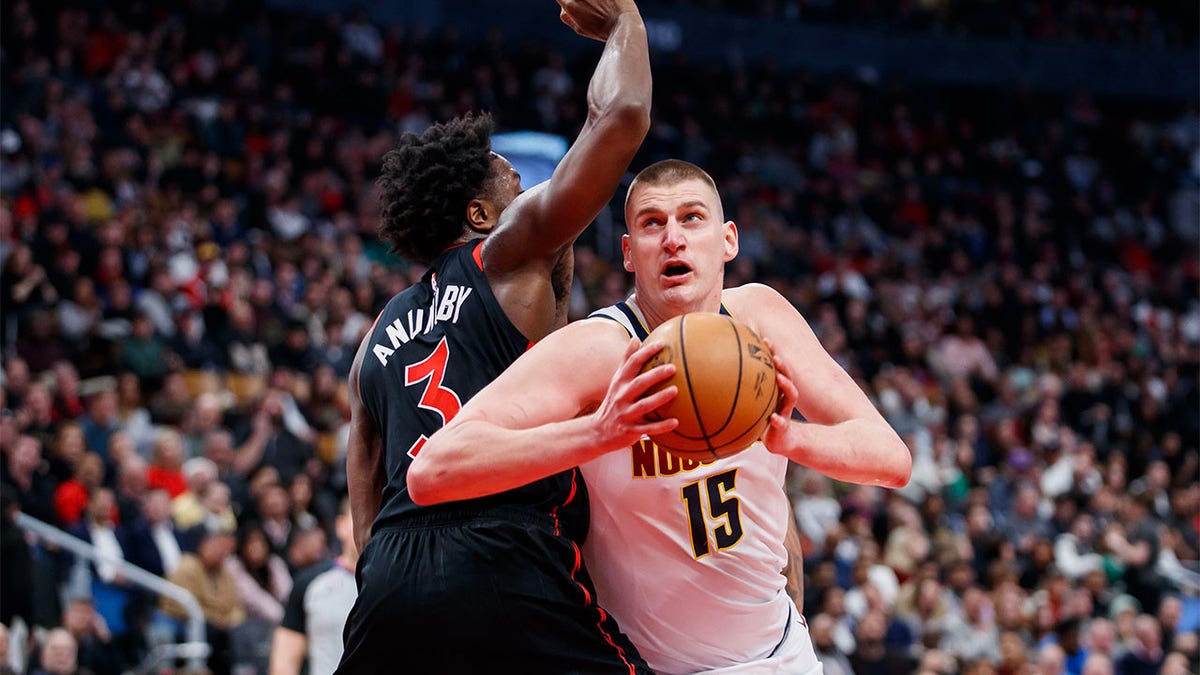 Nikola Jokic plays against the Raptors
