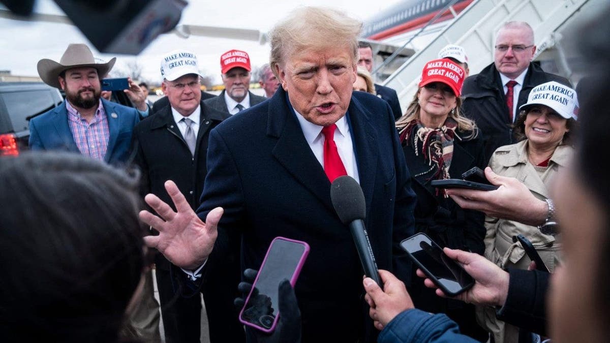 Former President Donald Trump speaks with reporters