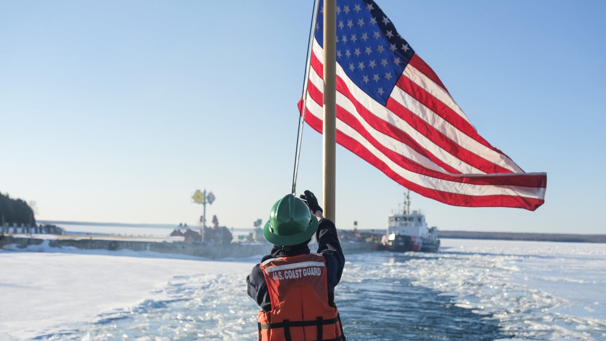 coast guard raising american flag 