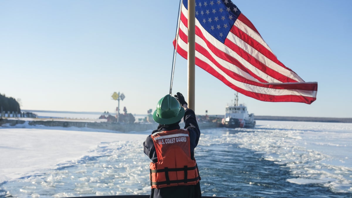 coast guard raising american flag