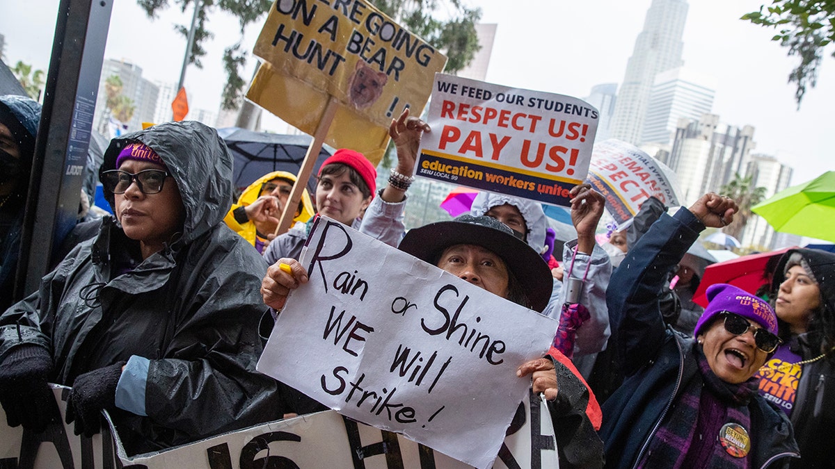 People holding signs