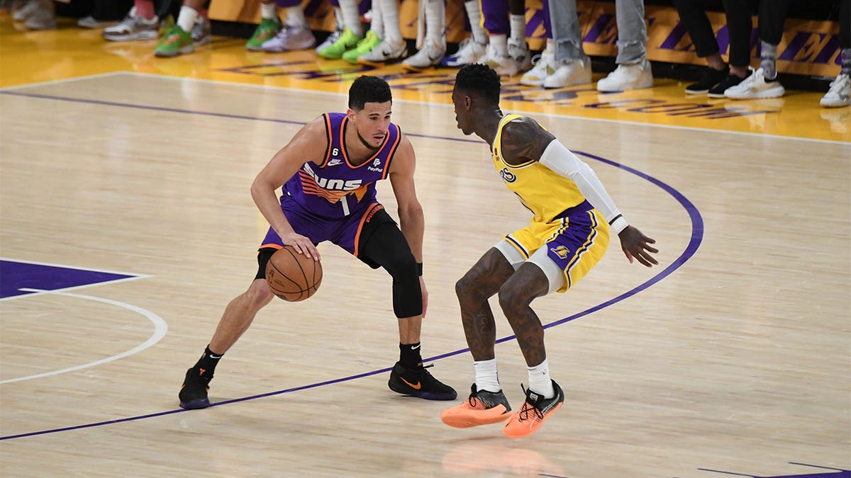 Devin Booker plays against the Lakers