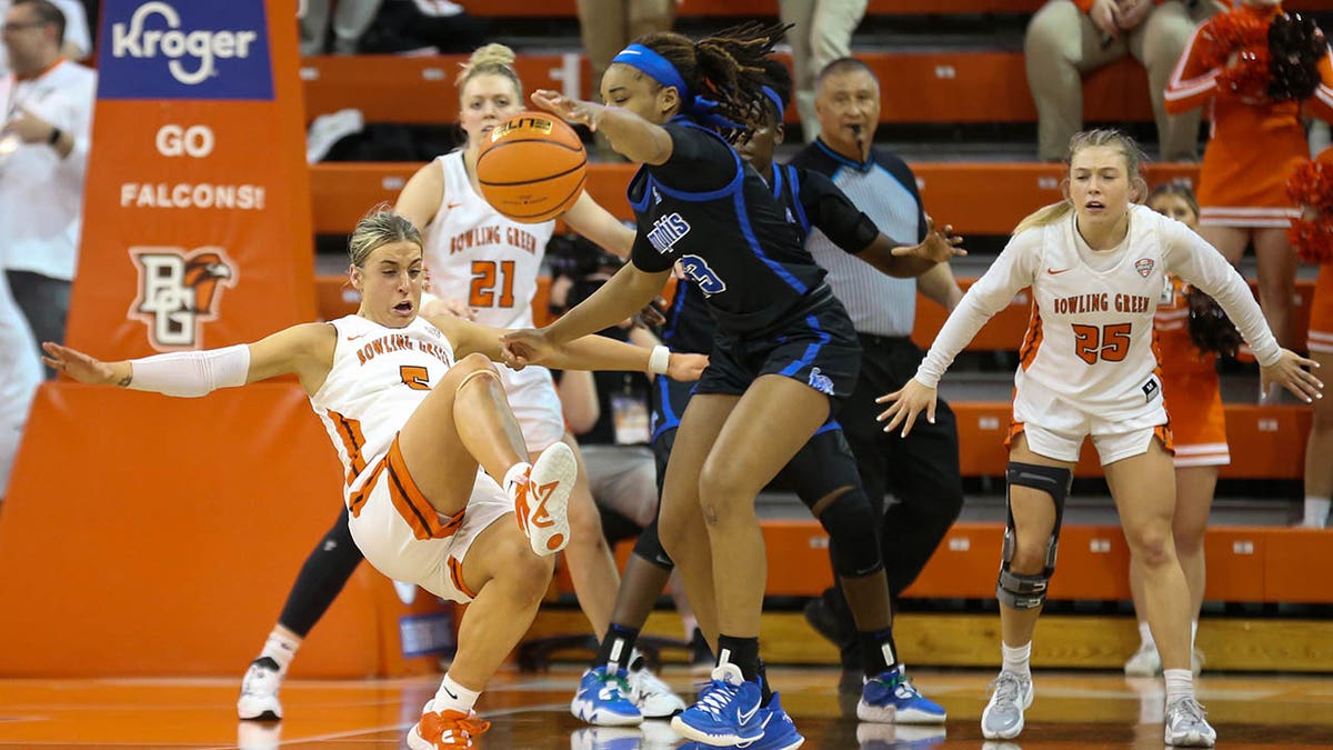 Elissa Brett tries to draw a call in the WNIT