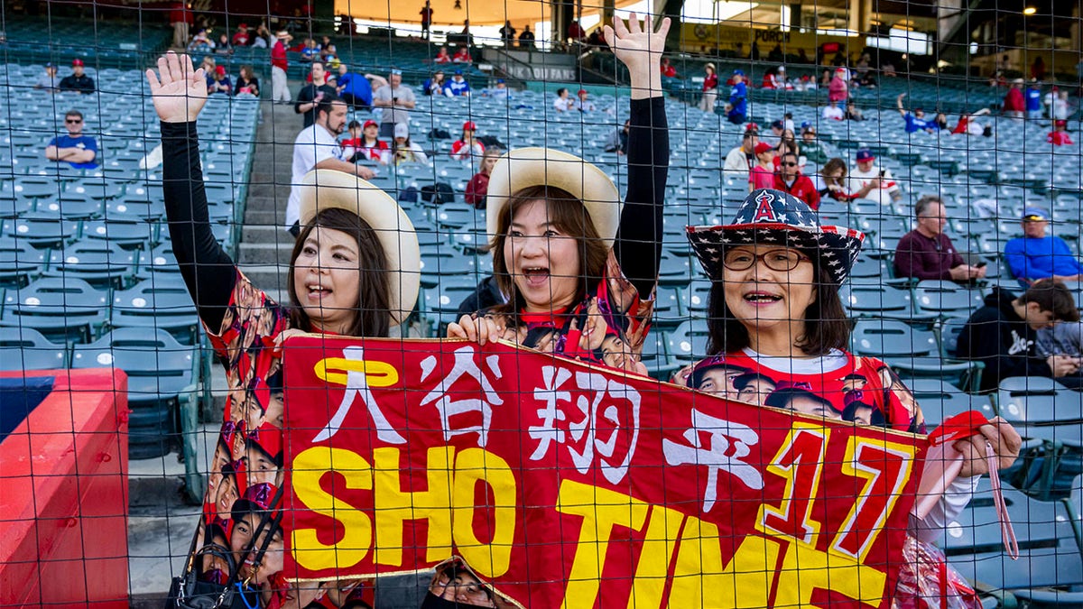 Fans of Shohei Ohtani cheer him on