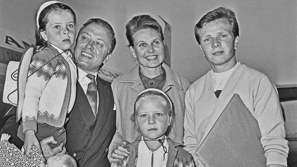 Attenborough family posing for photos at Heathrow airport in 1965