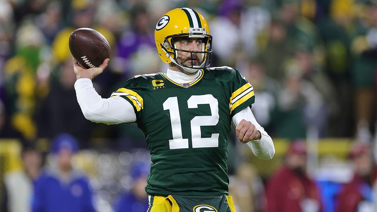 Aaron Rodgers looks to pass against the Vikings