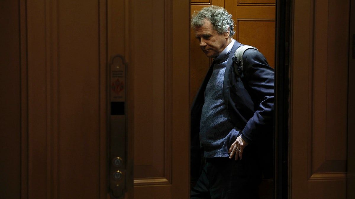 Sherrod Brown walking out door