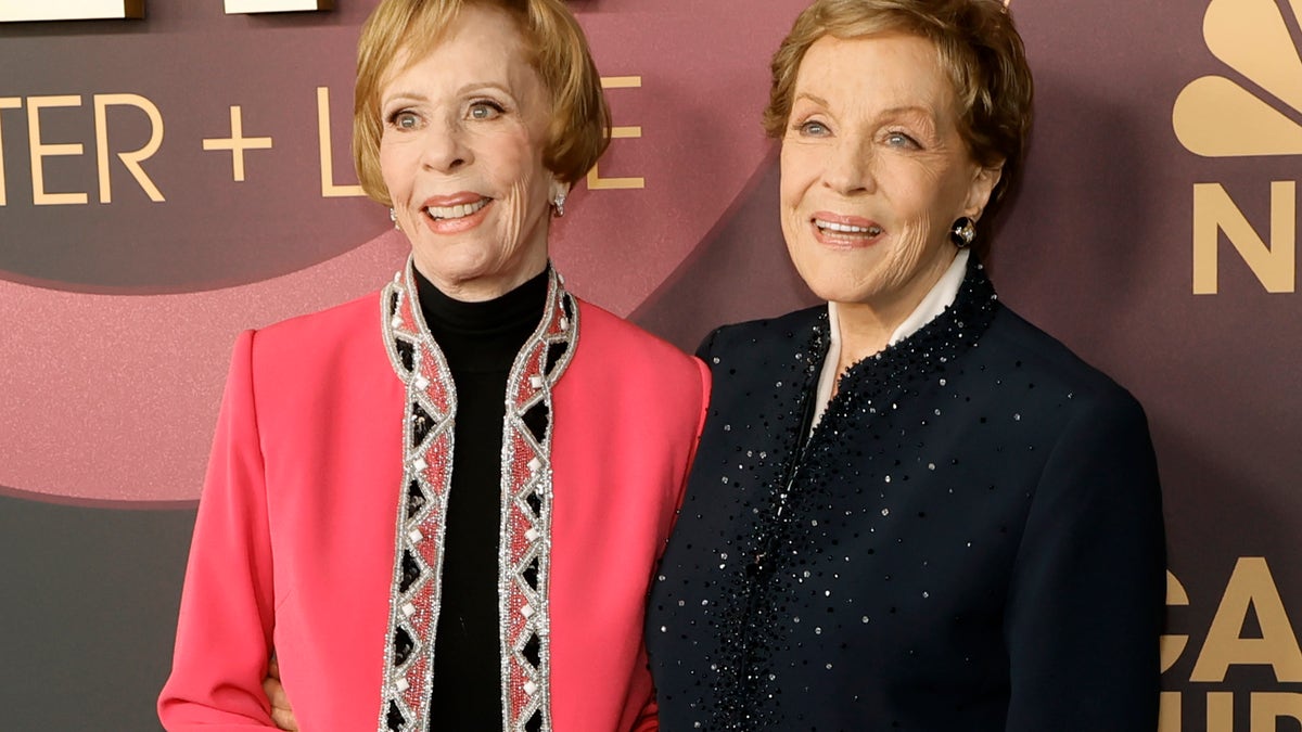 Carol Burnett in pink jacket and Julie Andrews in blue jacket at Carol Burnett event