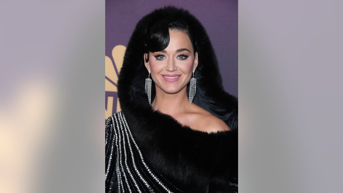 Katy Perry in a black furry hood