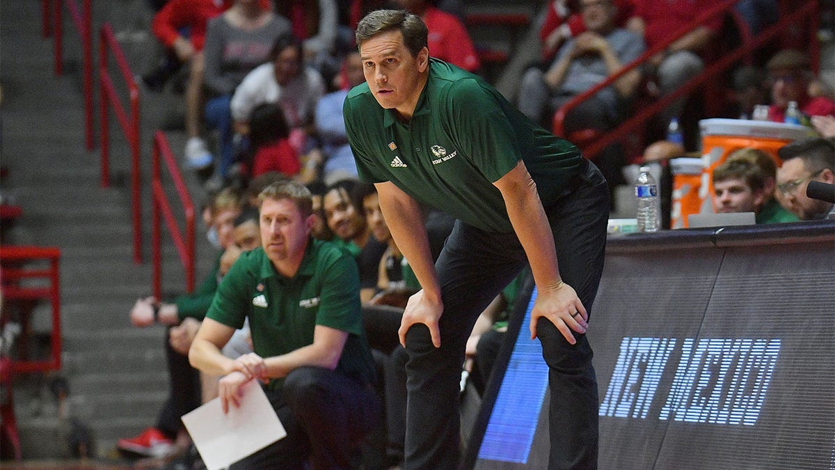 Mark Madsen coaches against New Mexico