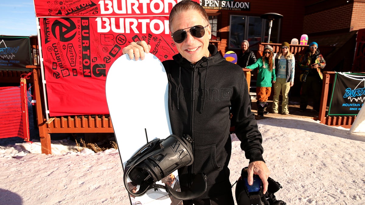 Tony Danza holding a snowboard