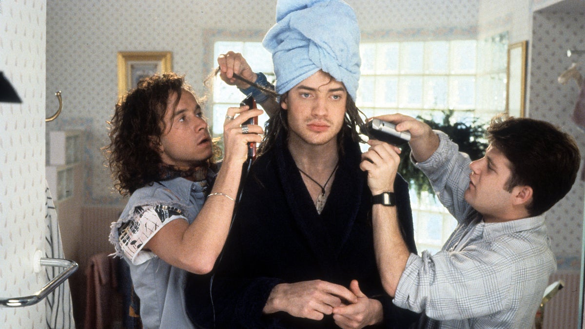 Pauly Shore blow drying Brendan Fraser's hair with Sean Astin