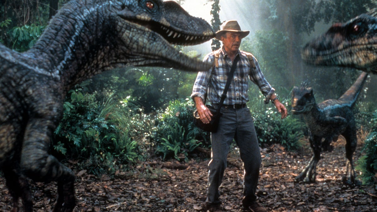 Sam Neill with dinosaurs in Jurassic Park III