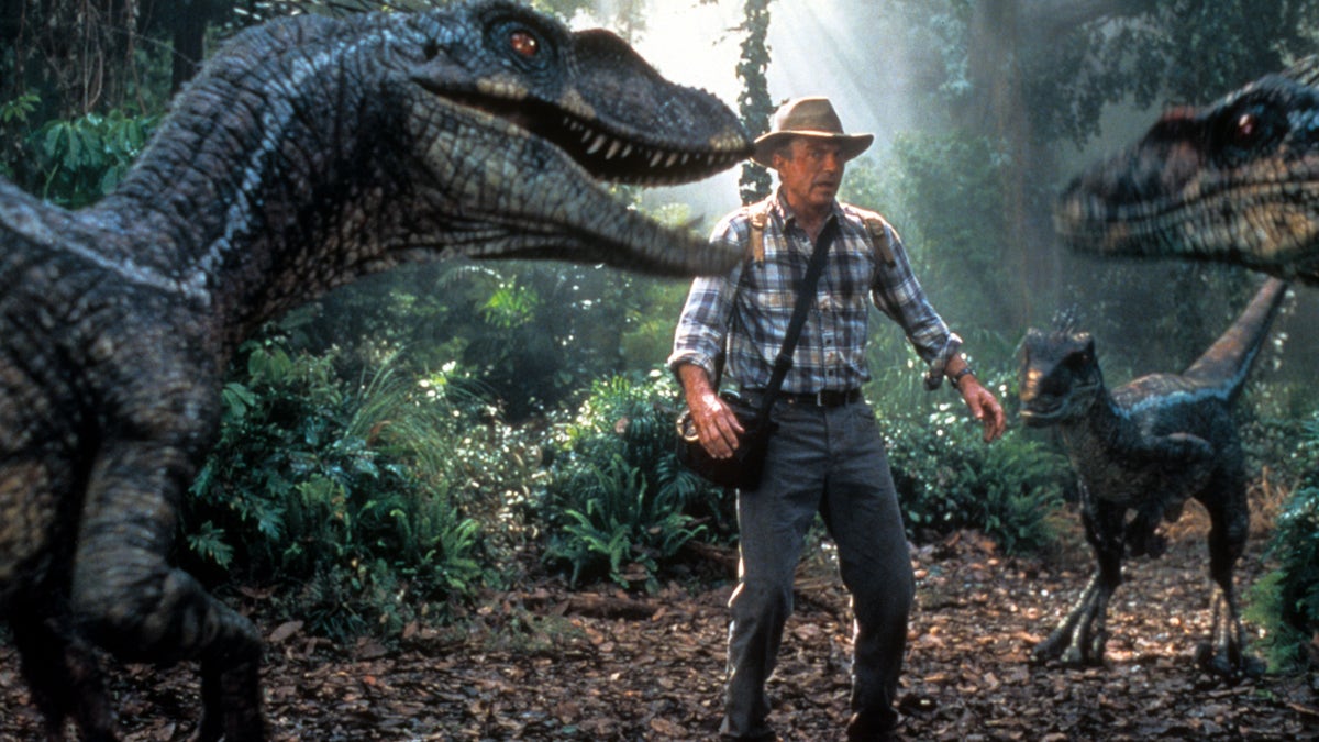 Sam Neill with dinosaurs in Jurassic Park III