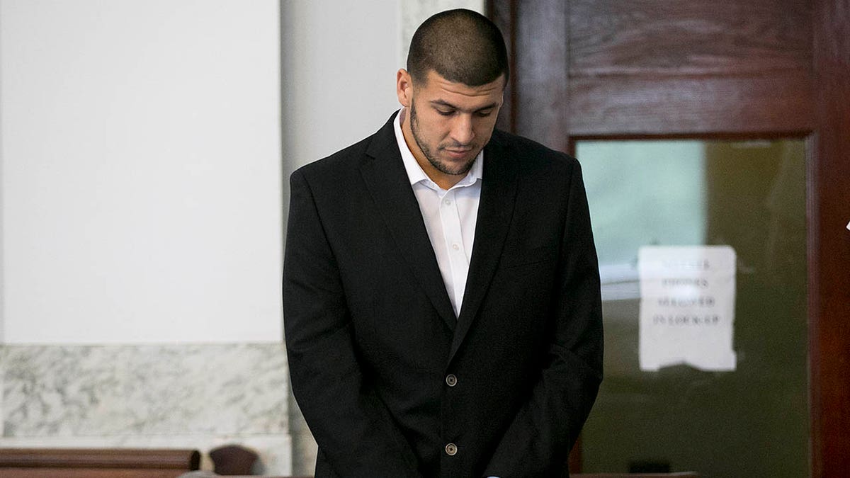 Aaron Hernandez stands in court