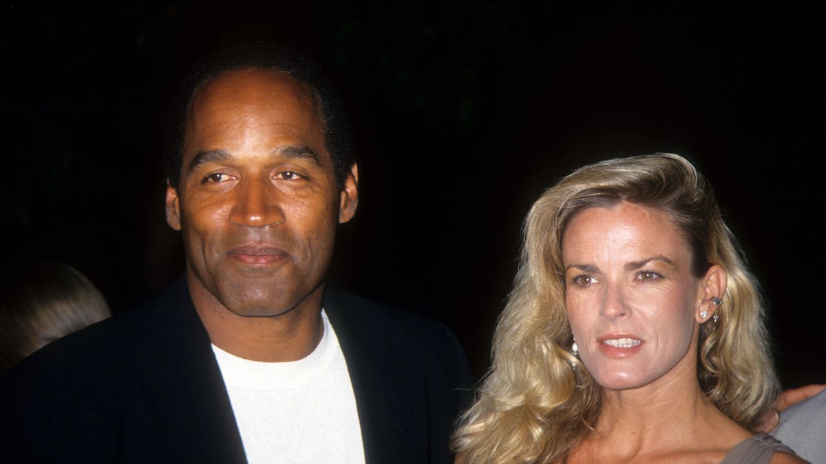 O.J. Simpson and Nicole Brown Simpson pose 