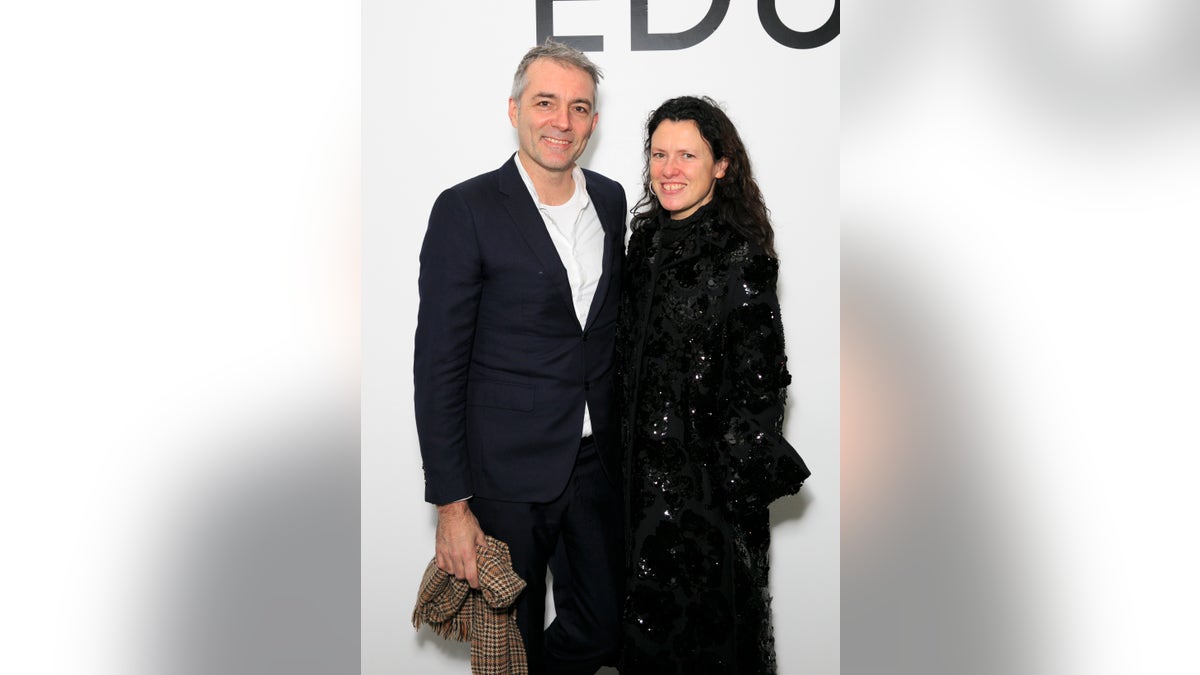 Steve Mackey and Katie Grand pose together on red carpet