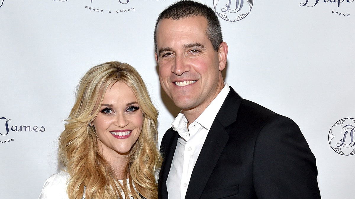 Reese Witherspoon and Jim Toth smiling