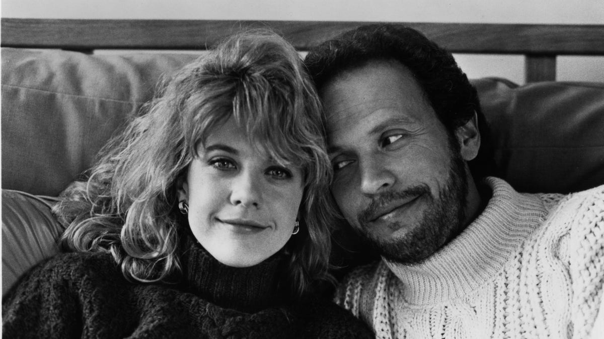 Black and white photo of Meg Ryan and Billy Crystal wearing sweaters in "When Harry Met Sally"