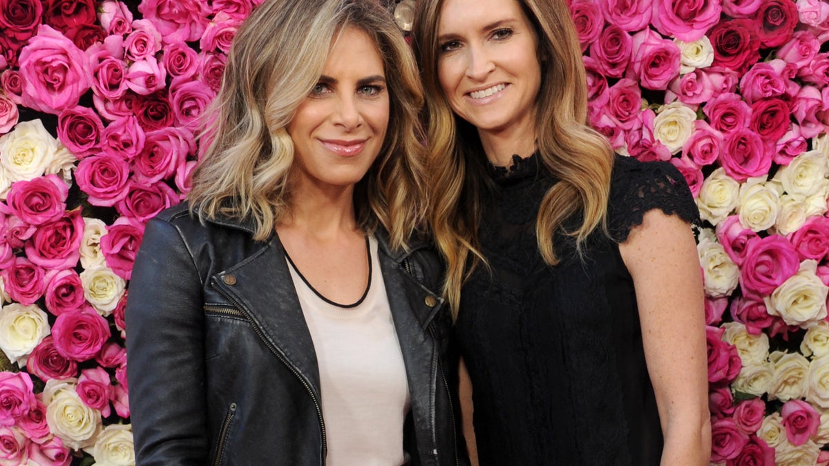 Jillian Michaels and her ex fiancé Heidi Rhoades smiling at an event