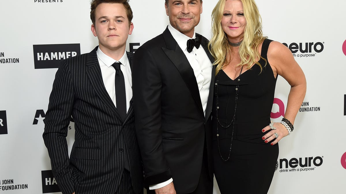 John Owen Lowe, Rob Lowe, Sheryl Berkoff posing together on red carpet