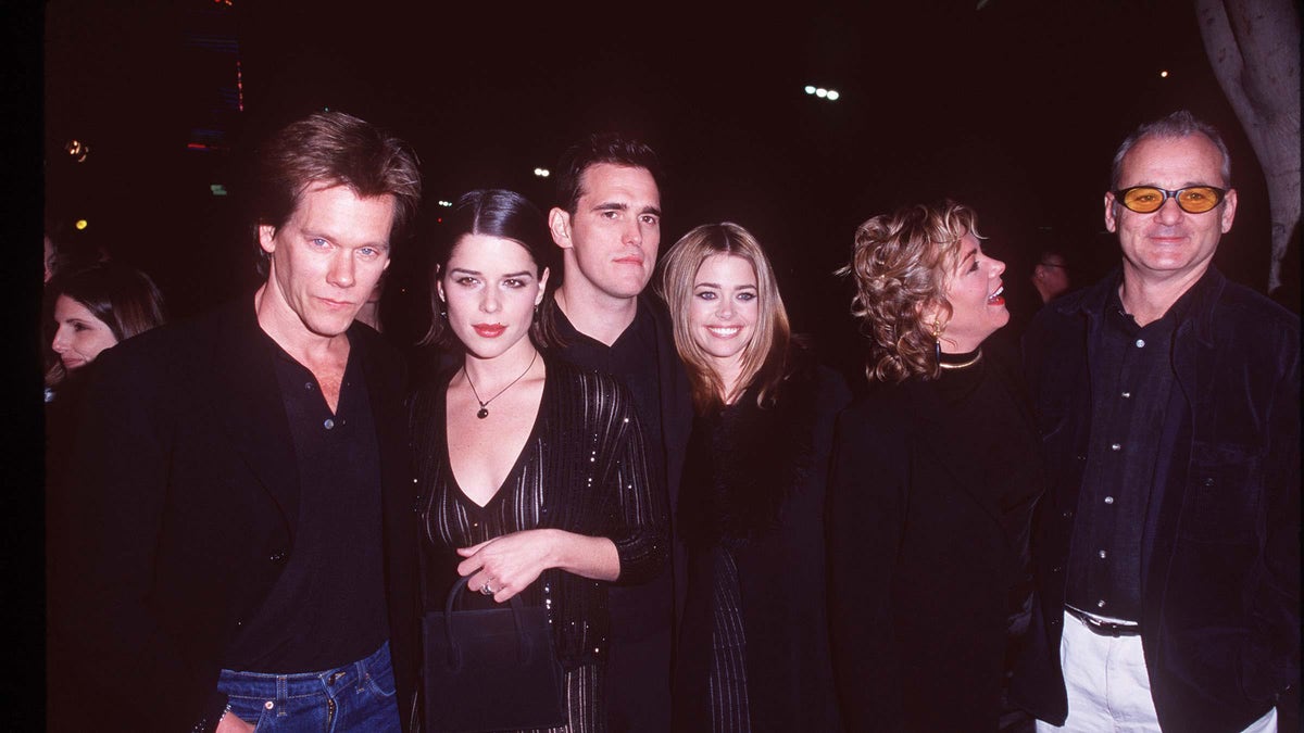 Bill Murray, Neve Campbell, Matt Dillon, Kevin Bacon, and Denise Richards pose together on the red carpet at the Wild Things premiere