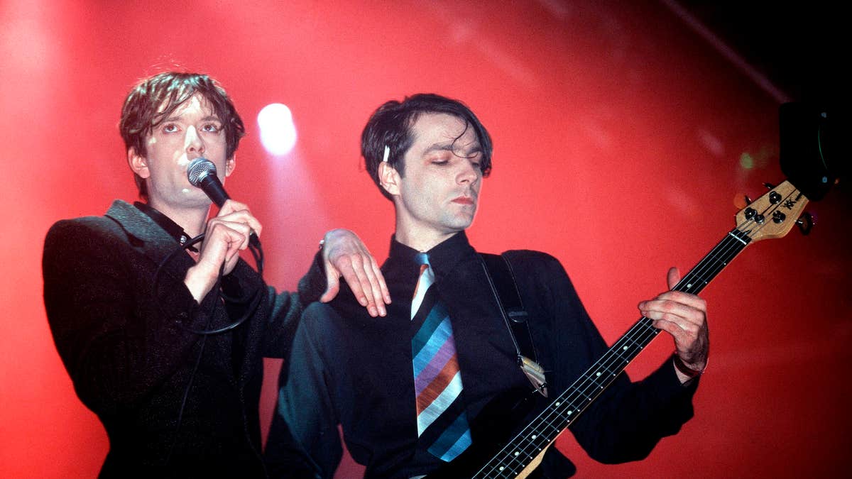 Steve Mackey and Jarvis Cocker playing and singing on stage