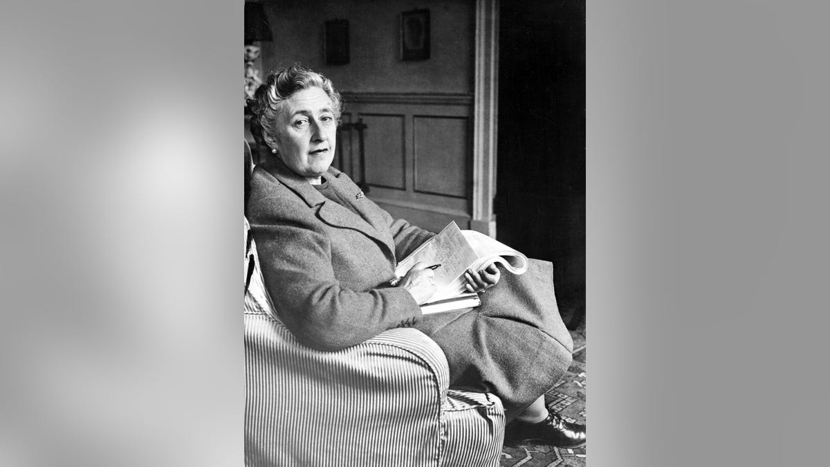 Agatha Christie sitting in chair