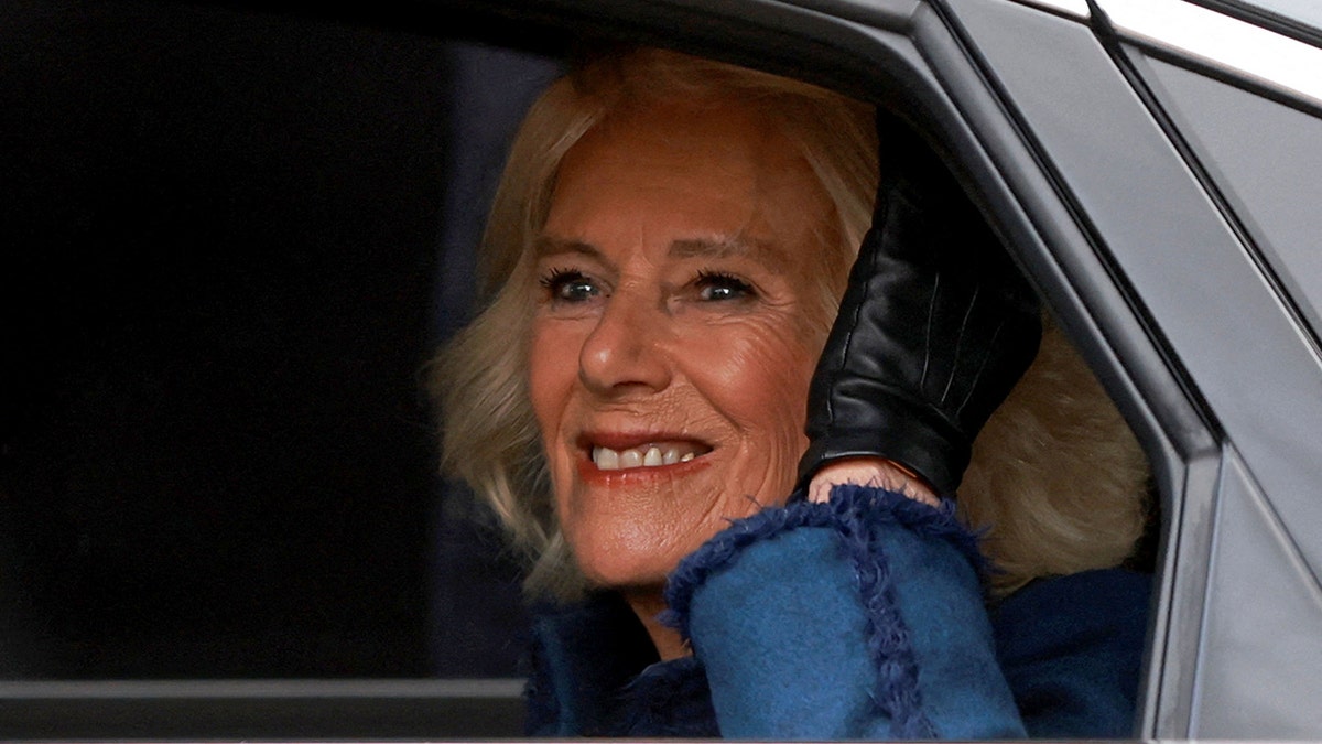 A close-up of Camilla in a car smiling