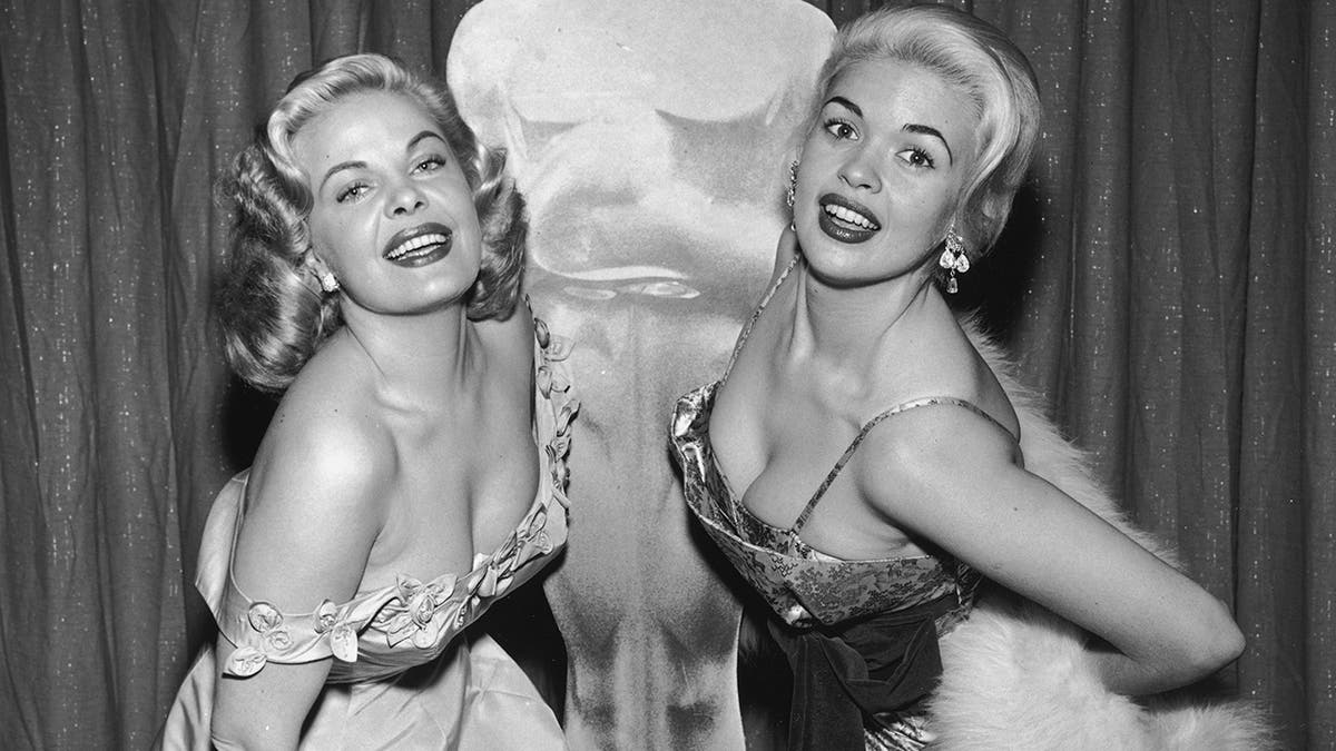 Cleo Moore and Jayne Mansfield pose for a photo