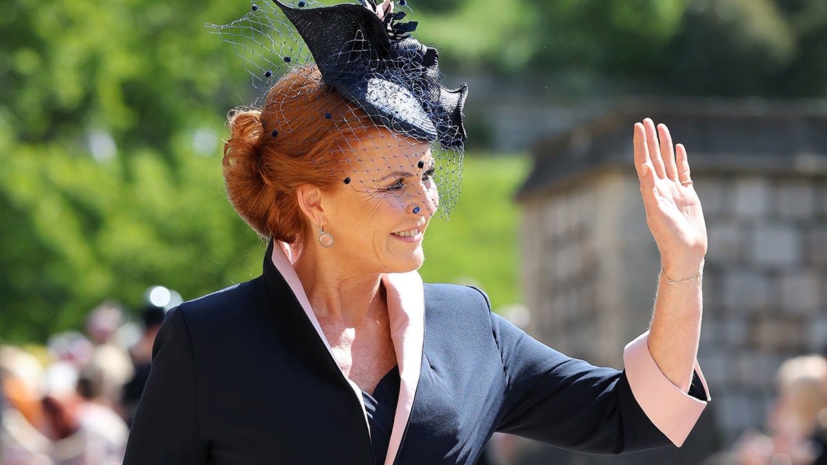 Sarah Ferguson Duchess of York waving to a crowd outside Windsor