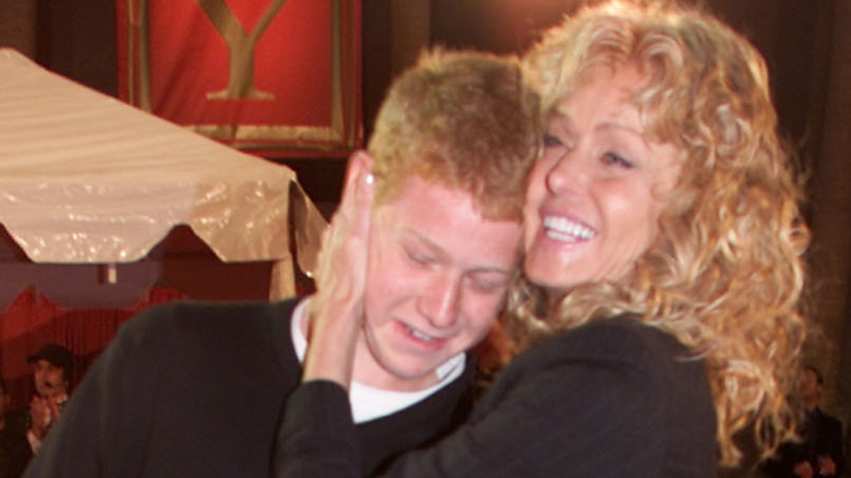 A close-up of Farrah Fawcett embracing her son Redmond