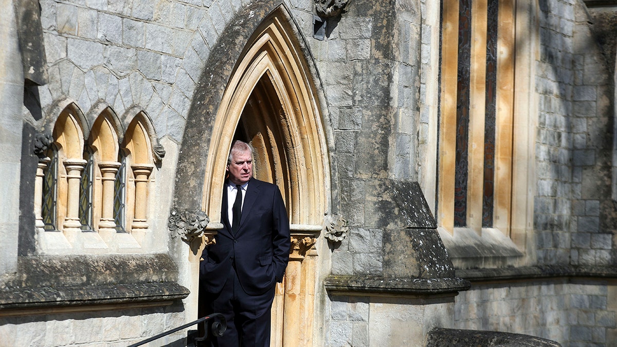 Prince Andrew stepping out in a suit outside of a churche at the Royal lodge