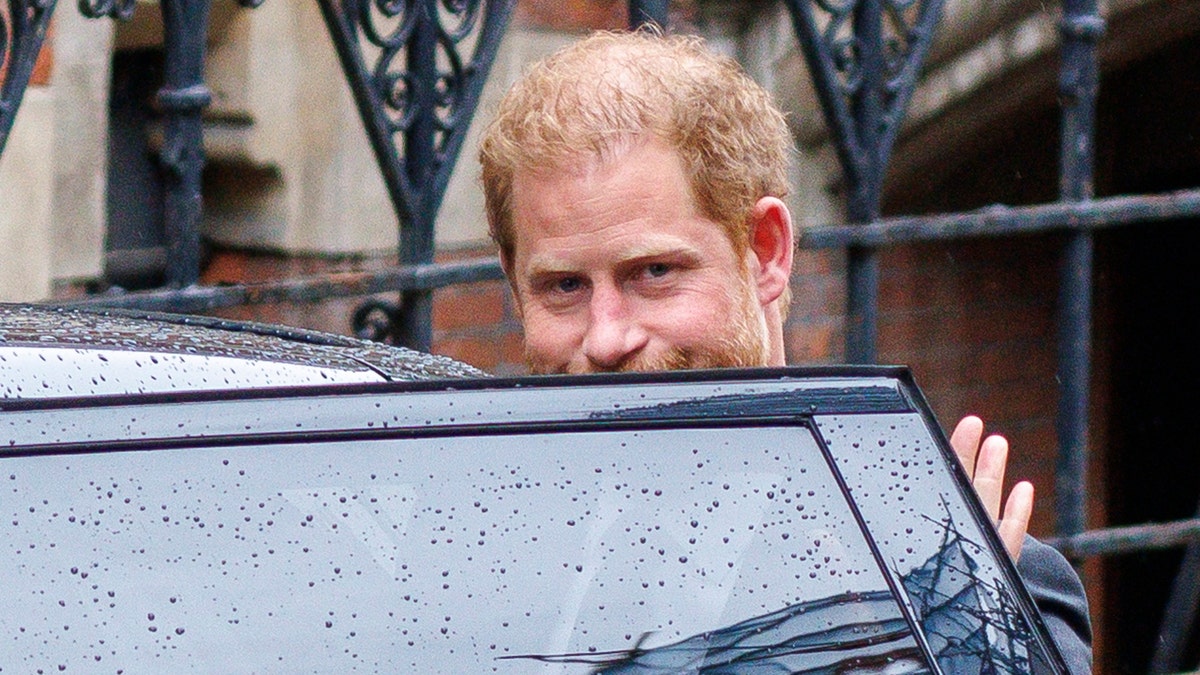 Prince Harry entering a car in London