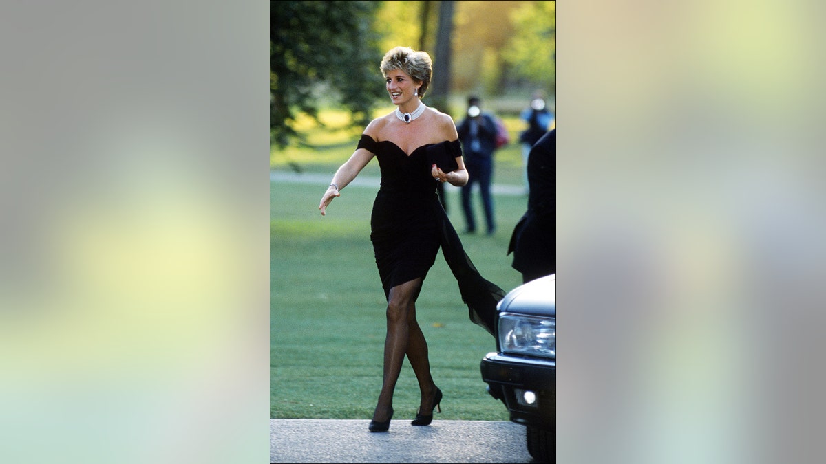 Princess Diana strutting in her revenge dress for the cameras