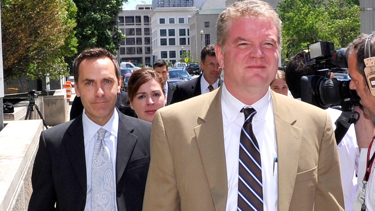 Victor Zaborsky walking behind his lawyer in 2010