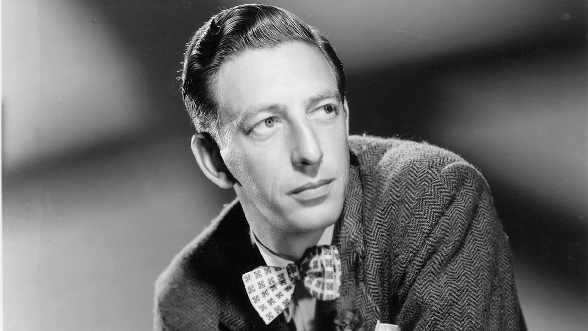 A close-up black and white photo of Ray Bolger