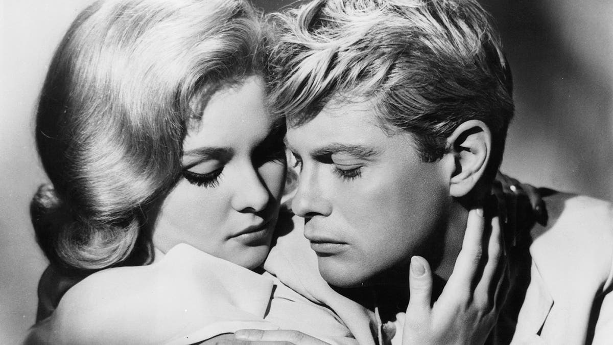 Diane McBain and Troy Donahue get close in a scene from the film 'Parrish', 1961. (