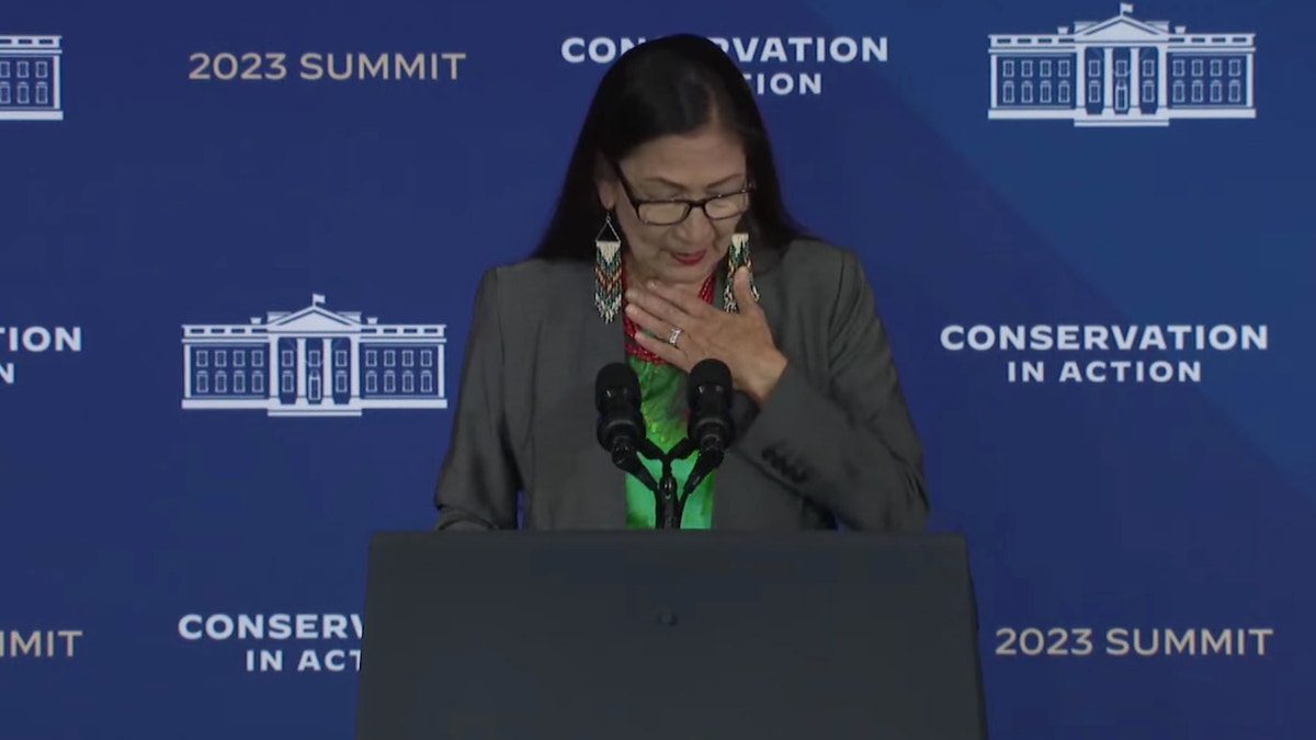 Interior Secretary Deb Haaland chokes up speaking about conservation efforts on March 21, 2023.